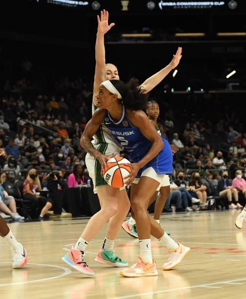 Jasmine Thomas of the Connecticut Sun looks to take a shot while being defended by Sue Bird of the Seattle Storm during the 2021 Commissioner's Cup...