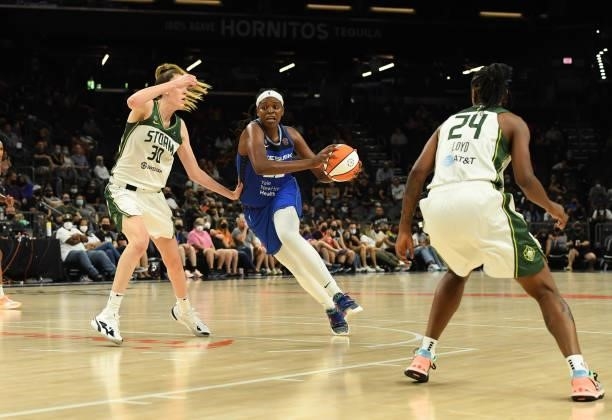 Jonquel Jones of the Connecticut Sun drives to the basket while being defended by Breanna Stewart of the Seattle Storm during the 2021 Commissioner's...