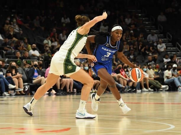 Kaila Charles of the Connecticut Sun drives to the basket while being defended by Stephanie Talbot of the Seattle Storm during the 2021...
