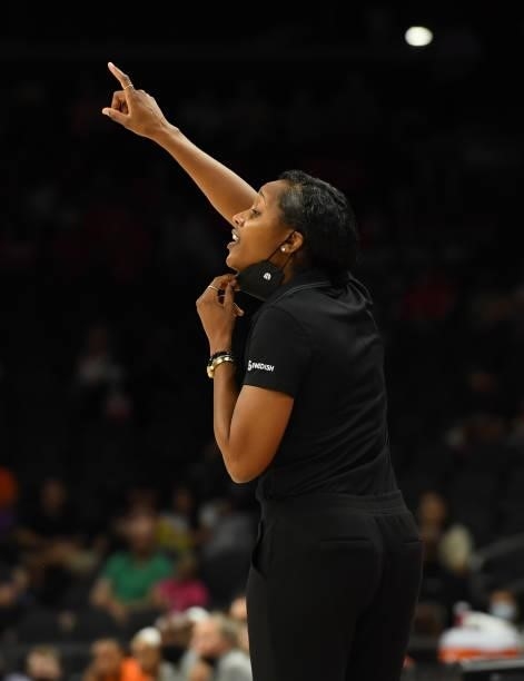 Head coach Noelle Quinn of the Seattle Storm yells to her players on the court against the Connecticut Sun during the 2021 Commissioner's Cup...