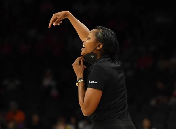 Head coach Noelle Quinn of the Seattle Storm yells to her players on the court against the Connecticut Sun during the 2021 Commissioner's Cup...