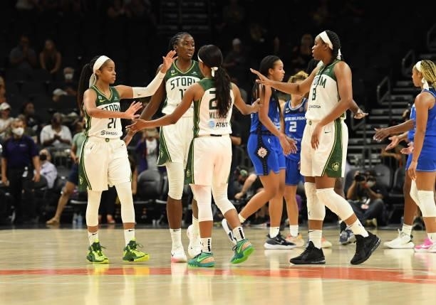 Ezi Magbefor, Jordin Canada, Kennedy Burke and Kiana Williams of the Seattle Storm celebrate a 79-57 win against the Connecticut Sun during the 2021...