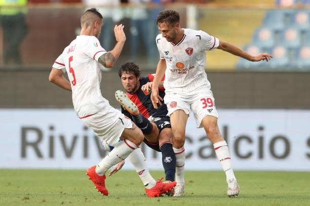 Gabriel Angella and Filippo Lorenzo Sgarbi of AC Perugia Calcio fouls Mattia Destro of Genoa CFC during the Coppa Italia match between Genoa CFC and...