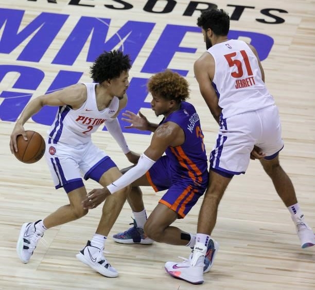 Grant Jerrett of the Detroit Pistons sets a screen for Cade Cunningham against Miles McBride of the New York Knicks during the 2021 NBA Summer League...
