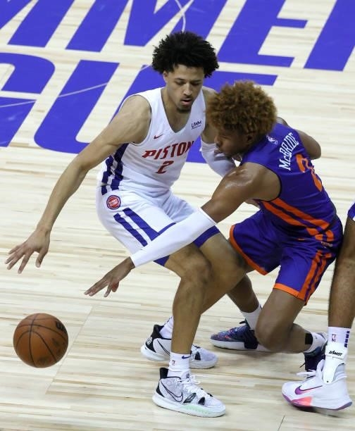 Miles McBride of the New York Knicks tries to steal the ball from Cade Cunningham of the Detroit Pistons during the 2021 NBA Summer League at the...