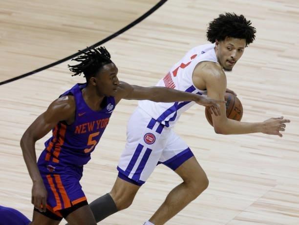 Cade Cunningham of the Detroit Pistons brings the ball up the court against Immanuel Quickley of the New York Knicks during the 2021 NBA Summer...
