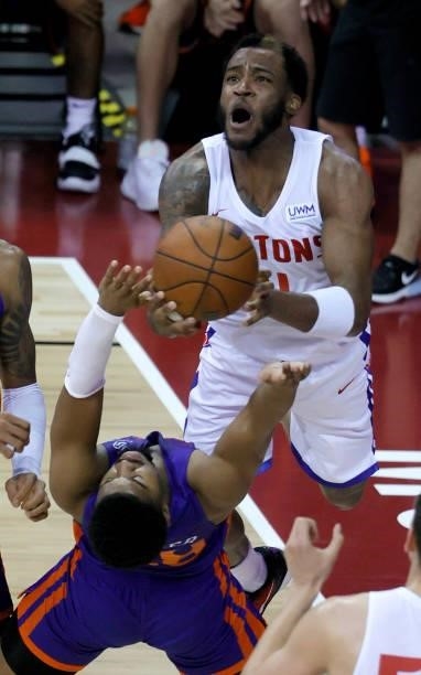 Walker of the New York Knicks takes a charge from Saddiq Bey of the Detroit Pistons during the 2021 NBA Summer League at the Thomas & Mack Center on...