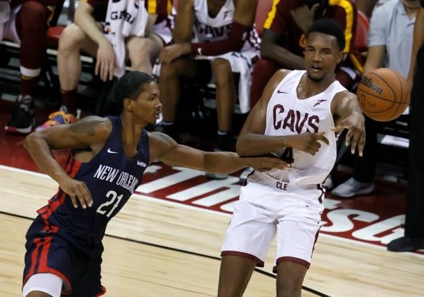 Evan Mobley of the Cleveland Cavaliers passes against Malcolm Hill of the New Orleans Pelicans during the 2021 NBA Summer League at the Thomas & Mack...