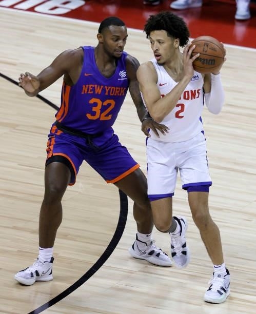 Cade Cunningham of the Detroit Pistons is guarded by Aamir Simms of the New York Knicks during the 2021 NBA Summer League at the Thomas & Mack Center...
