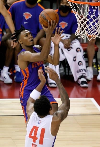 Immanuel Quickley of the New York Knicks drives to the basket against Saddiq Bey of the Detroit Pistons during the 2021 NBA Summer League at the...