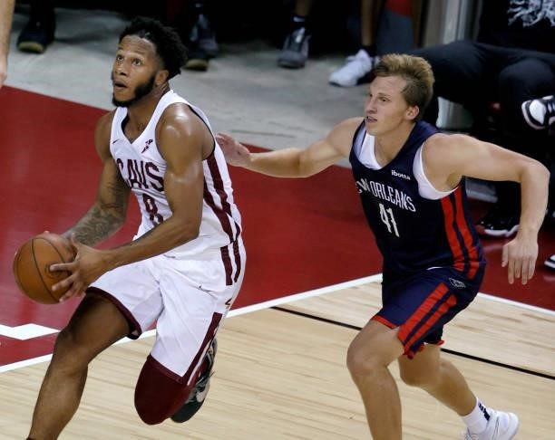 Lamar Stevens of the Cleveland Cavaliers drives to the basket against David DiLeo of the New Orleans Pelicans during the 2021 NBA Summer League at...