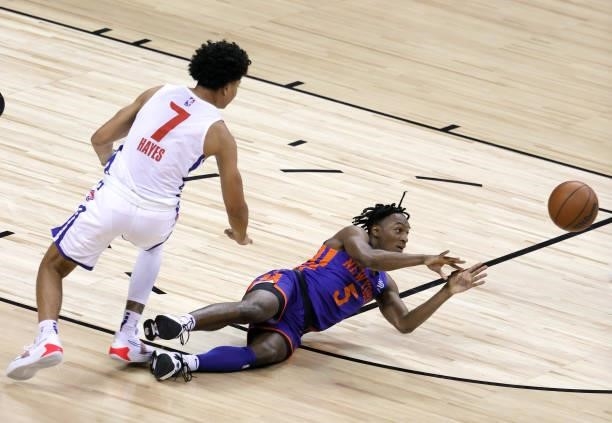 Immanuel Quickley of the New York Knicks passes against Killian Hayes of the Detroit Pistons after securing a loose ball during the 2021 NBA Summer...
