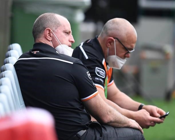 Tigers coach Michael Maguire looks on before the start of the round 22 NRL match between the North Queensland Cowboys and the Wests Tigers at QCB...