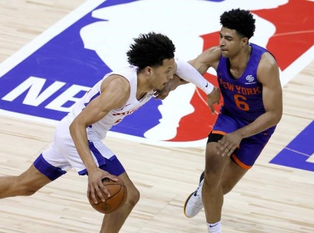 Cade Cunningham of the Detroit Pistons drives against Quentin Grimes of the New York Knicks during the 2021 NBA Summer League at the Thomas & Mack...