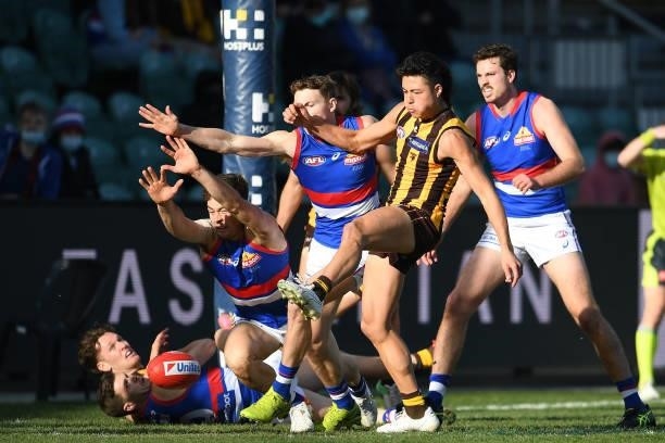 Connor Downie of the Hawks kicks the ball during the round 22 AFL match between Hawthorn Hawks and Western Bulldogs at University of Tasmania Stadium...