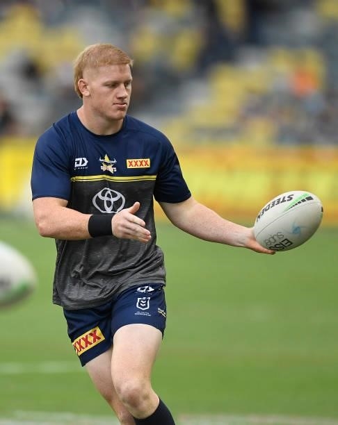 Griffin Neame of the Cowboys warms up before the start of the round 22 NRL match between the North Queensland Cowboys and the Wests Tigers at QCB...