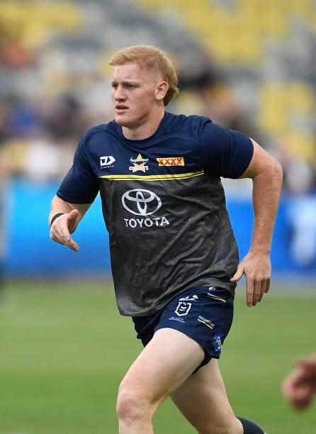 Griffin Neame of the Cowboys warms up before the start of the round 22 NRL match between the North Queensland Cowboys and the Wests Tigers at QCB...