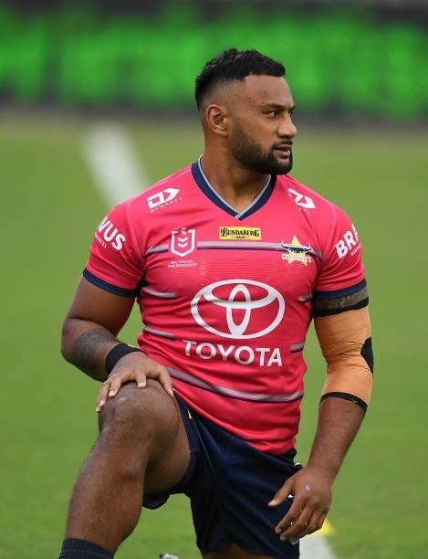 Francis Molo of the Cowboys warms up before the start of the round 22 NRL match between the North Queensland Cowboys and the Wests Tigers at QCB...
