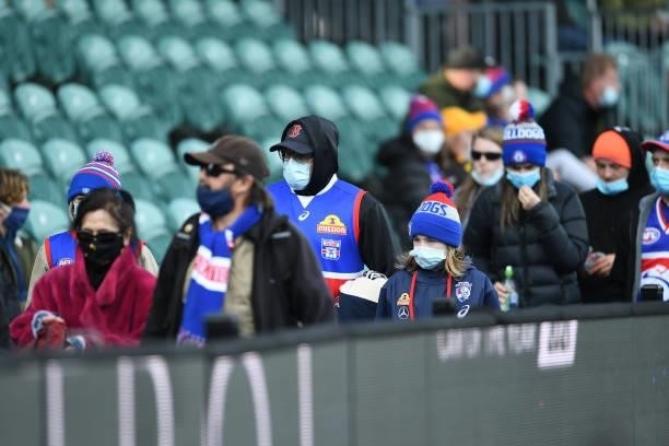 Bulldogs fans are seen leaving before the end of the game during the round 22 AFL match between Hawthorn Hawks and Western Bulldogs at University of...