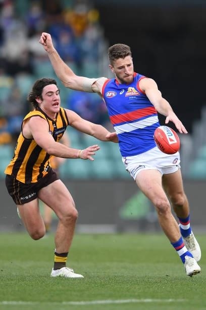 Marcus Bontempelli of the Bulldogs is tackled by Jai Newcombe of the Hawks during the round 22 AFL match between Hawthorn Hawks and Western Bulldogs...