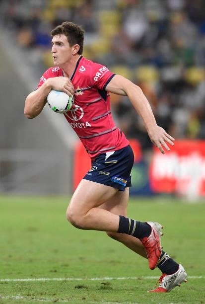 Ben Condon of the Cowboys runs the ball during the round 22 NRL match between the North Queensland Cowboys and the Wests Tigers at QCB Stadium, on...