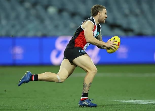 Dean Kent of the Saints runs with the ball during the round 22 AFL match between Geelong Cats and St Kilda Saints at GMHBA Stadium on August 14, 2021...