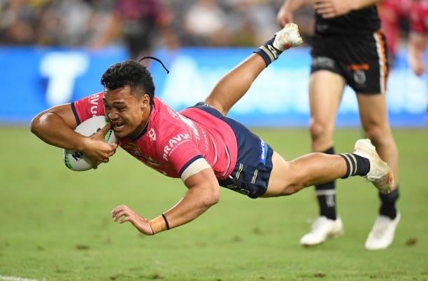 Jeremiah Nanai of the Cowboys scores a try during the round 22 NRL match between the North Queensland Cowboys and the Wests Tigers at QCB Stadium, on...