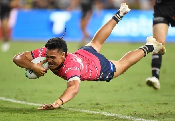 Jeremiah Nanai of the Cowboys scores a try during the round 22 NRL match between the North Queensland Cowboys and the Wests Tigers at QCB Stadium, on...