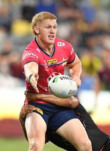 Griffin Neame of the Cowboys passes the ball during the round 22 NRL match between the North Queensland Cowboys and the Wests Tigers at QCB Stadium,...