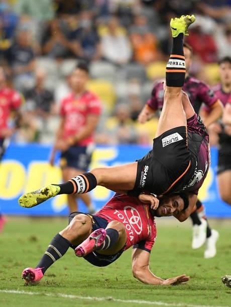 David Nofoaluma of the Tigers collides with Valentine Holmes of the Cowboys after taking a high ball during the round 22 NRL match between the North...