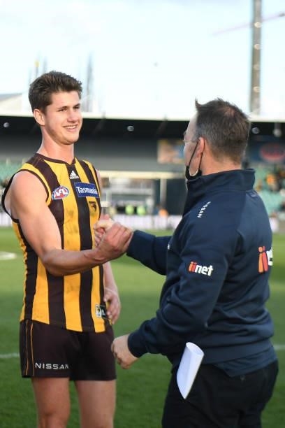 Alastair Clarkson Head Coach of the Hawks congratulates Daniel Howe of the Hawks after the game during the round 22 AFL match between Hawthorn Hawks...