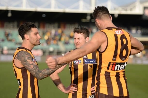 Chad Wingard, Liam Shiels and Jonathon Ceglar of the Hawks celebrate after the game during the round 22 AFL match between Hawthorn Hawks and Western...