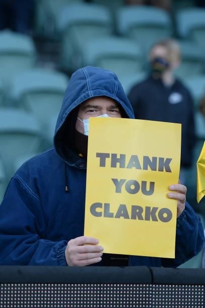 Fan holds up a sign reading "Thank you Clarko