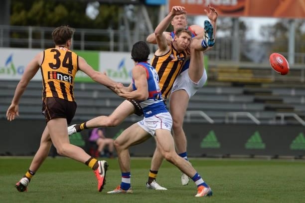 Ben McEvoy of the Hawks and Tim English of the Bulldogs compete for the ball during the round 22 AFL match between Hawthorn Hawks and Western...