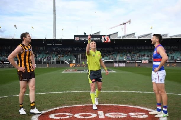 Ben McEvoy of the Hawks and Marcus Bontempelli of the Bulldogs watch the coin toss during the round 22 AFL match between Hawthorn Hawks and Western...