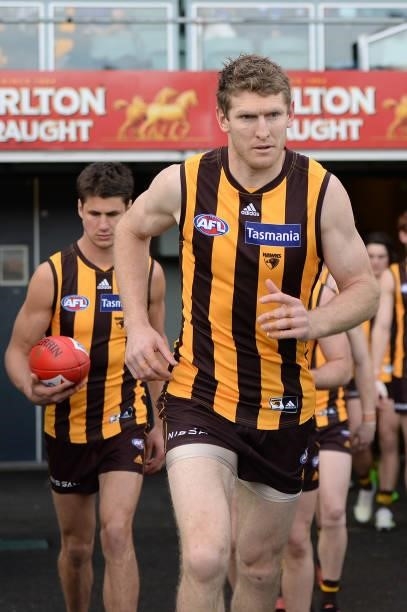 Ben McEvoy of the Hawks leads out the team during the round 22 AFL match between Hawthorn Hawks and Western Bulldogs at University of Tasmania...