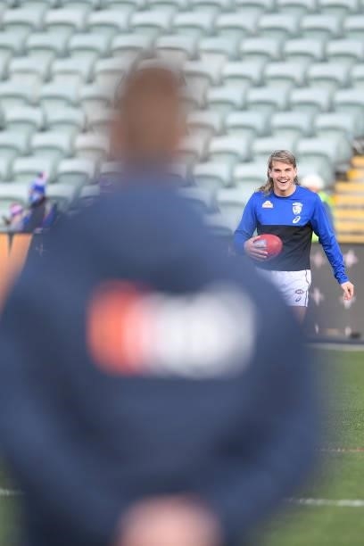 Sam Mitchell, Head of Development of the Hawks watches Bailey Smith of the Bulldogs during warmup during the round 22 AFL match between Hawthorn...