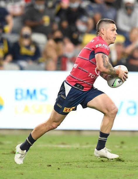 Ben Hampton of the Cowboys runs the ball during the round 22 NRL match between the North Queensland Cowboys and the Wests Tigers at QCB Stadium, on...