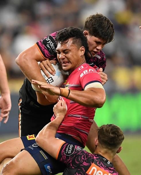 Jeremiah Nanai of the Cowboys is tackled during the round 22 NRL match between the North Queensland Cowboys and the Wests Tigers at QCB Stadium, on...