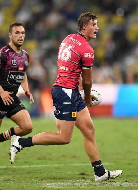 Mitch Dunn of the Cowboys runs the ball during the round 22 NRL match between the North Queensland Cowboys and the Wests Tigers at QCB Stadium, on...