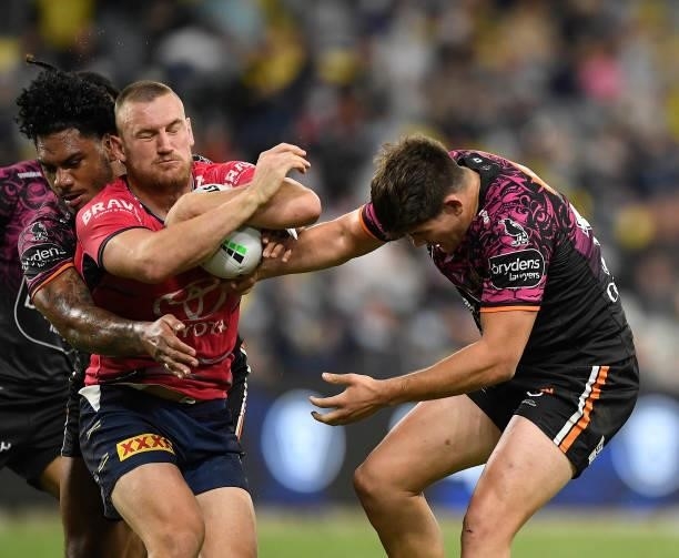 Coen Hess of the Cowboys is tackled during the round 22 NRL match between the North Queensland Cowboys and the Wests Tigers at QCB Stadium, on August...