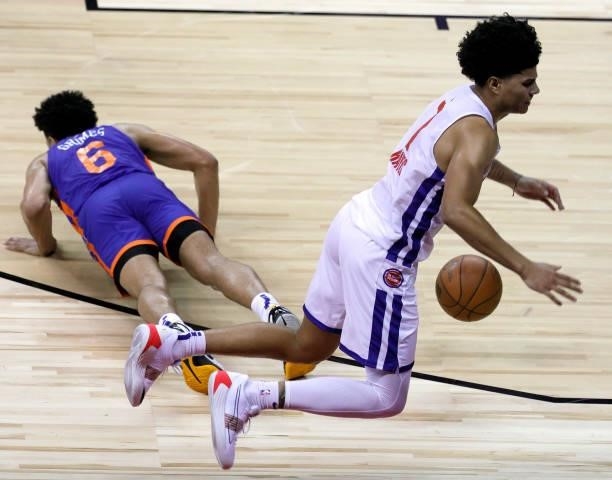 Quentin Grimes of the New York Knicks and Killian Hayes of the Detroit Pistons fall after Grimes fouled Hayes during the 2021 NBA Summer League at...