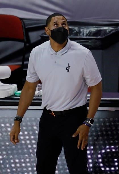 Head coach J.J. Outlaw of the Cleveland Cavaliers checks the scoreboard during a game against the New Orleans Pelicans during the 2021 NBA Summer...