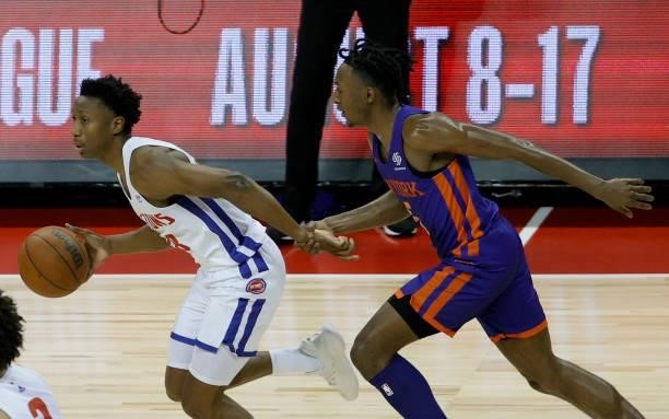 Immanuel Quickley of the New York Knicks grabs the wrist of Saben Lee of the Detroit Pistons during the 2021 NBA Summer League at the Thomas & Mack...