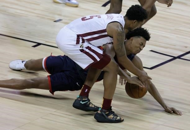 Trevon Bluiett of the Cleveland Cavaliers and Trey Murphy III of the New Orleans Pelicans go after a loose ball during the 2021 NBA Summer League at...