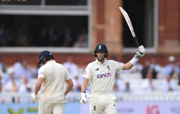 England batsman Joe Root reaches his 50 during day three of the Second Test Match between England and India at Lord's Cricket Ground on August 14,...