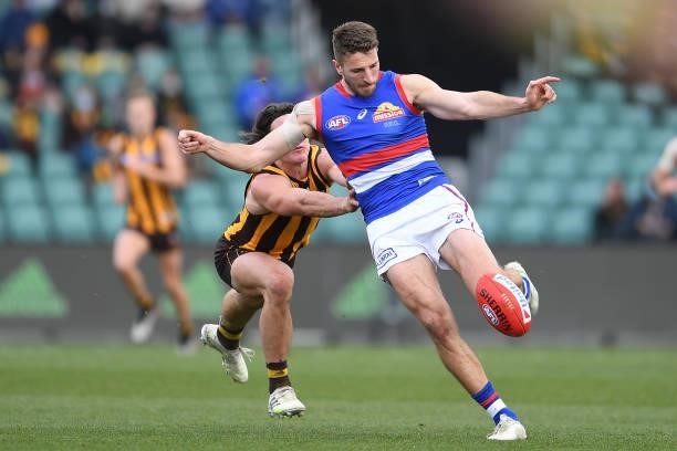 Marcus Bontempelli of the Bulldogs kicks the ball during the round 22 AFL match between Hawthorn Hawks and Western Bulldogs at University of Tasmania...