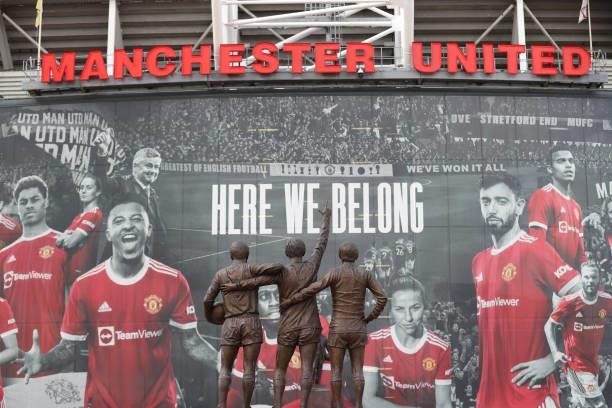 General view outside the stadium where the United Trinity statue is seen prior to the Premier League match between Manchester United and Leeds United...