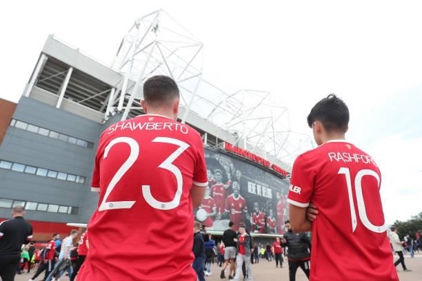 General view outside the stadium where fans are seen wearing Luke Shaw and Marcus Rashford of Manchester United shirts prior to the Premier League...