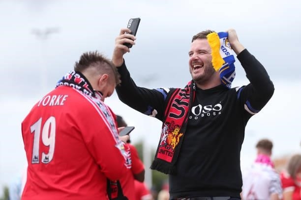 Leeds United fan shows their support prior to the Premier League match between Manchester United and Leeds United at Old Trafford on August 14, 2021...